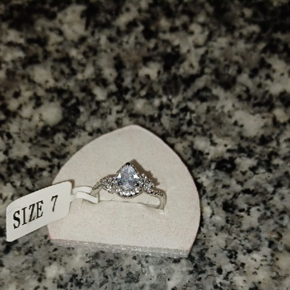 Timeless Silver Solitaire Engagement Ring with Accent Details